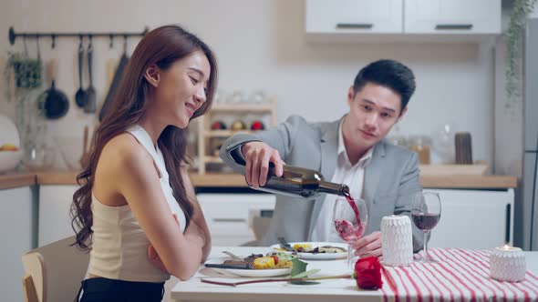 Asian young couple having dinner to celebrate valentine's day together. alt