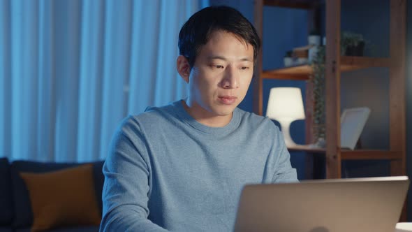 Asia freelance businessman focus working typing on laptop computer online remotelyใ