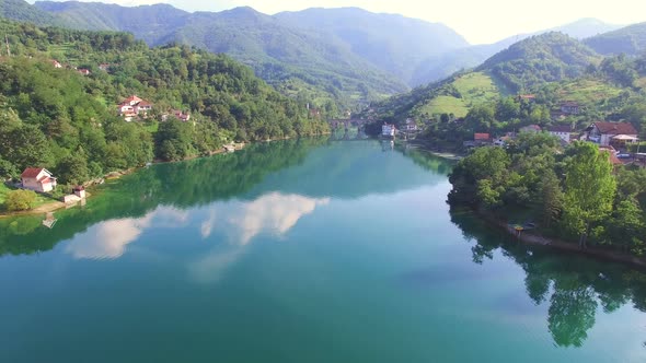 Flying over clear river in Bosnia alt