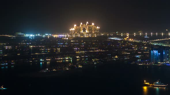 Jumeirah Night Beach Aerial Panorama Dubai Time Lapse. Pan Up alt