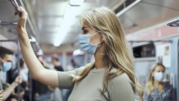 Masked Face Woman Carriage Subway Corona Virus. Crowd Passengers Train Covid-19. alt