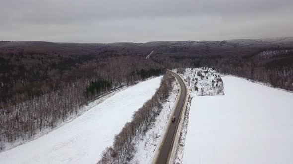 Heavy Truck And Car On Winter Road