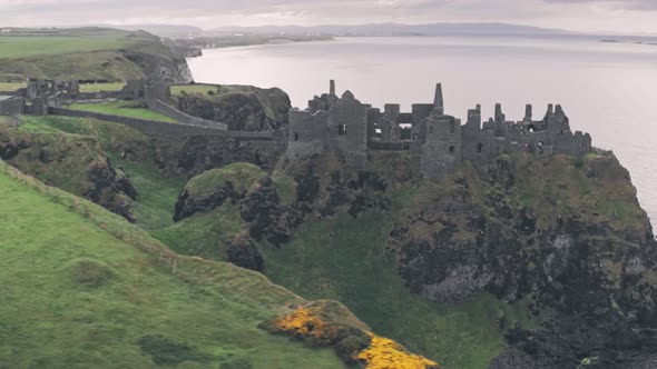 Ruins of Dunluce Castle, Antrim Coast, Northern Ireland. Aerial drone view alt