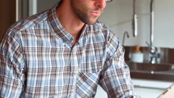 Handsome man using digital tablet alt