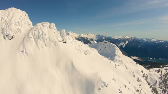 Flying Over Jagged Snowy Mountain Peaks North Cascades Range Reveal Huge Valley Baker Lake alt