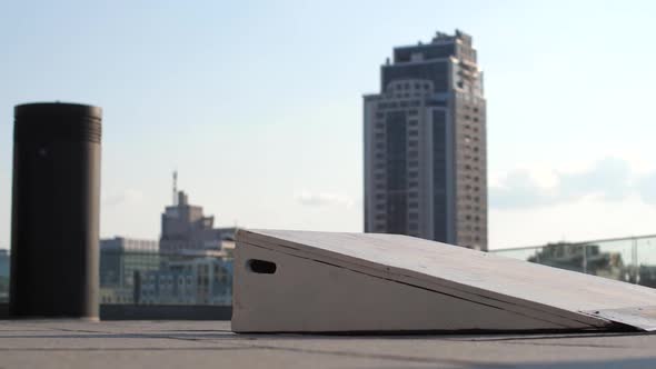 Legs of Skater Jumping From Bank Doing Ollie Trick alt