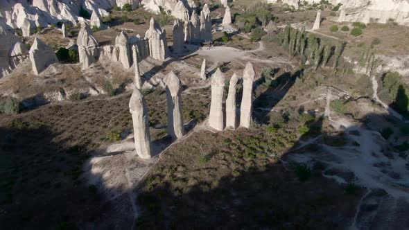 Flying over rock formations at Love Valley, Cappadocia, Turkey alt