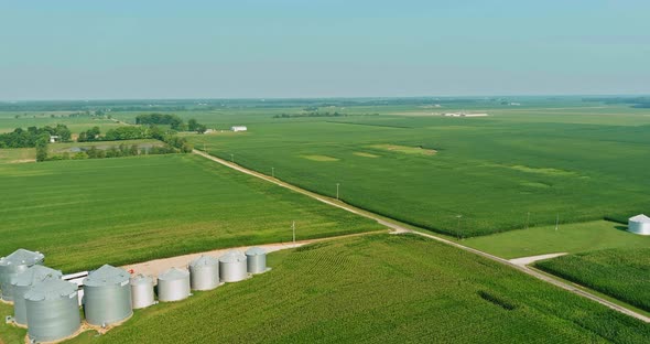 Grain Elevator with Large Storage Bins of Corn Grain on Aerial Top View alt