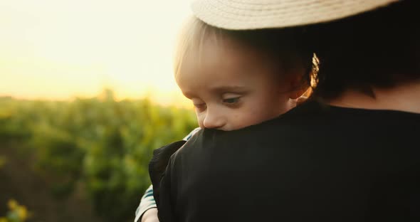 Portrait of Young Mother Gently Hugging Her Cute Little Baby Son in French Provence Vineyard During alt