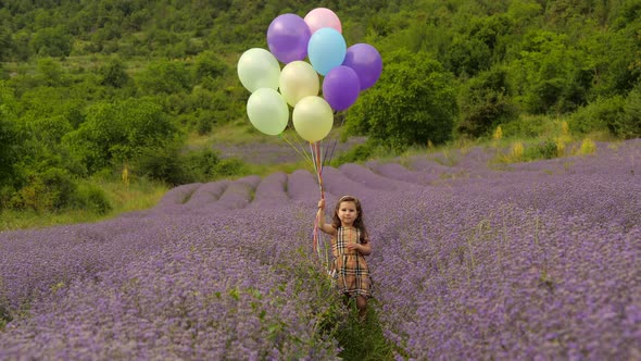 Little Girl with Balloons in Lavender Garden