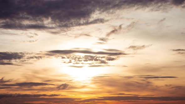 Time lapse sunrise and beautiful twilight fluffy storm cloudy blue and yellow sky