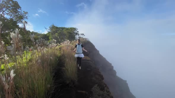 Woman Hiking By Steep Slope in Cloud at Sunset Outdoor Hawaii Island Nature alt