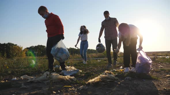 Family of Eco Volunteers in Masks Clean Lawn of Plastic and Paper Waste Saving Nature alt