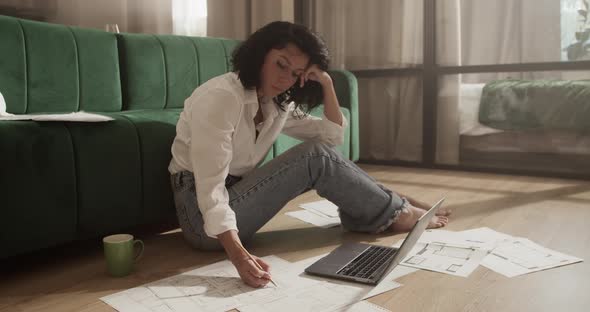 Female Architect Working on Project at Home alt
