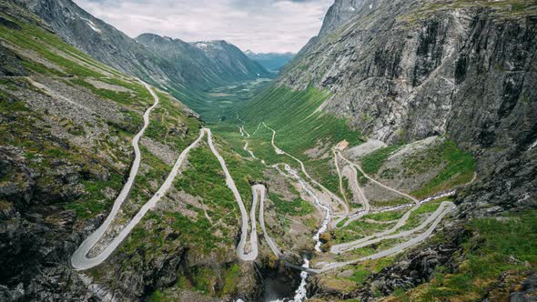 Trollstigen, Andalsnes, Norway. Cars Goes On Serpentine Mountain Road Trollstigen. Famous Norwegian alt