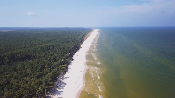 Drone footage of a sandy beach, sunny summer day, Baltic Sea, Poland, Lubiatowo. alt