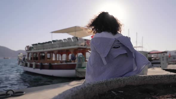 Portrait of beautiful woman use phone to navigate. Female tourist exploring city alt