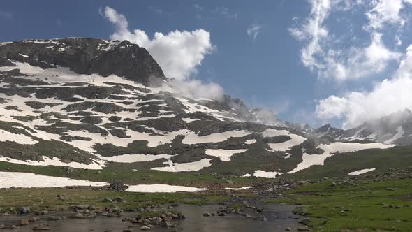 Panoramic Alpine Meadow and Stream in High Altitude Mountain alt
