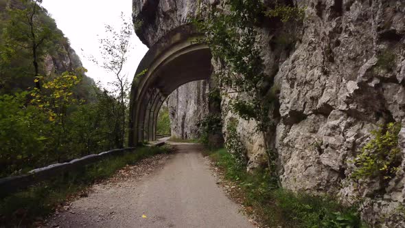 Aerial view from a drone on a road in the mountains. alt