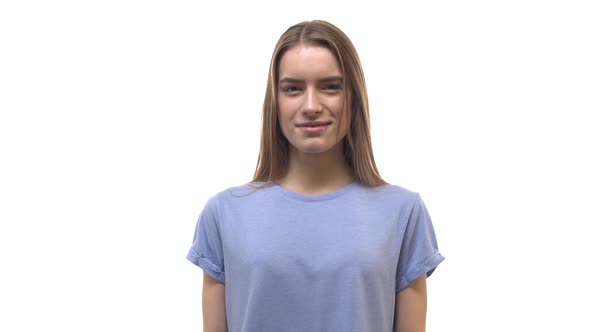 Slow Motion Gorgeous Blonde European 20s Girl Wearing Blue Tshirt Start Smiling Laughing Out Loud alt