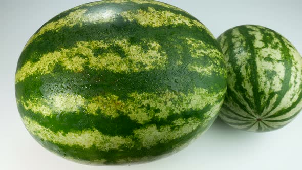 Two Watermelons On A White Surface