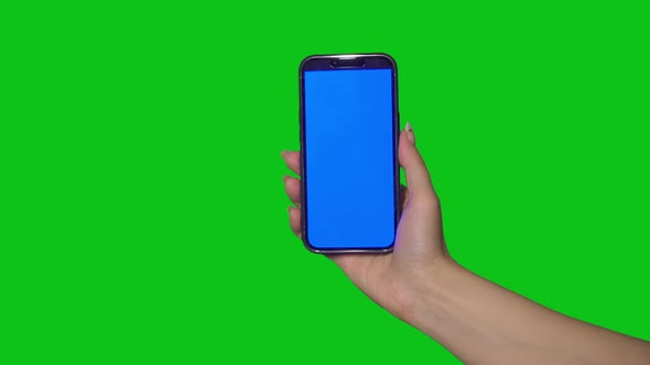 Person Woman Holding Smartphone on Green Chroma Key Background alt
