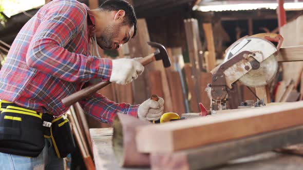 Carpenter marks out the details of the furniture . alt