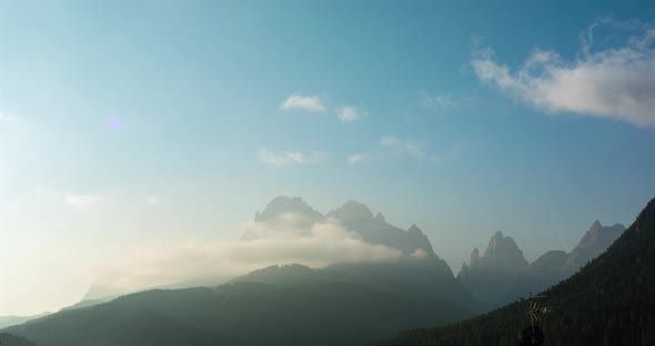 Time lapse of fast moving clouds at alpine mountrain range in 4k. Dolomites regi