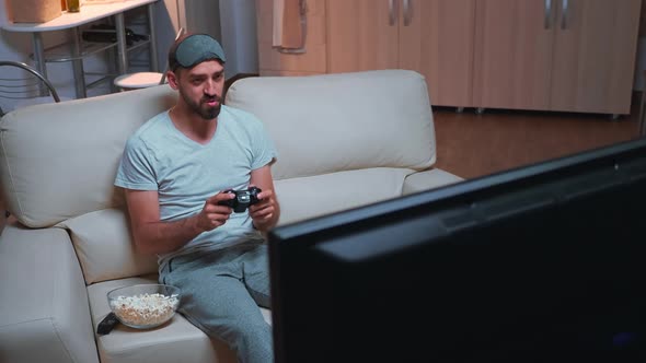 Disappointed Gamer Playing Soccer Videogame During Gaming Competition alt