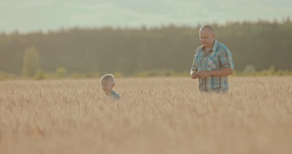 Happy Father and Son are on the Endless Field