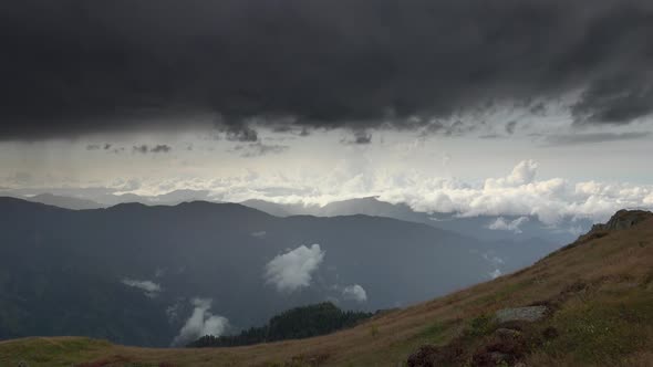 Black Dark Storm Clouds in Mountainous Terrain alt
