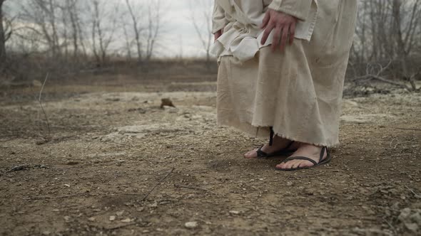 Closeup Of A Religious Man Kneeling To Pray alt