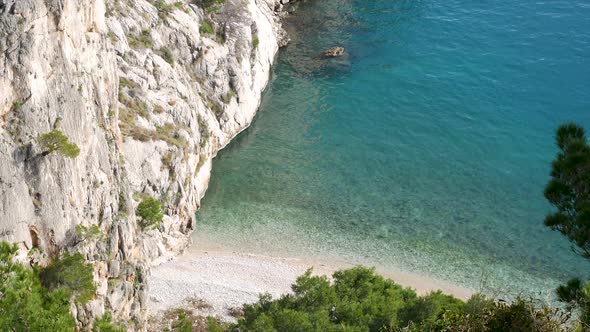 Small Hidden Beach On Adriatic Sea Coast With Calm Blue Sea
