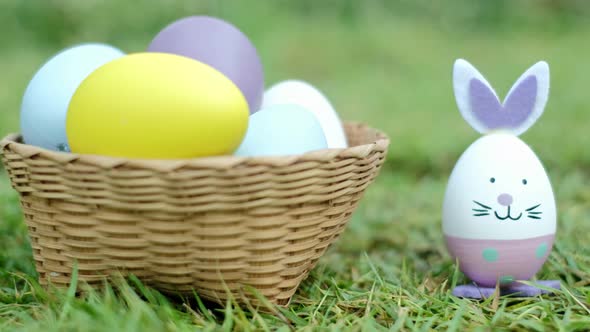 Easter bunny ornaments and Easter Eggs on lawn grass