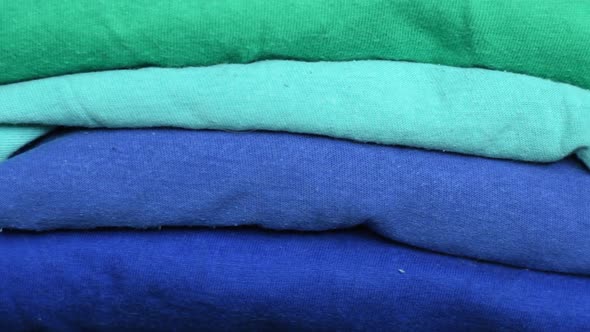Stack of folded fabric in different colors
