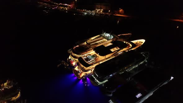 Aerial Night View of  Luxury Party Yachts in Harbor in Croatia in Mediterranean Harbour