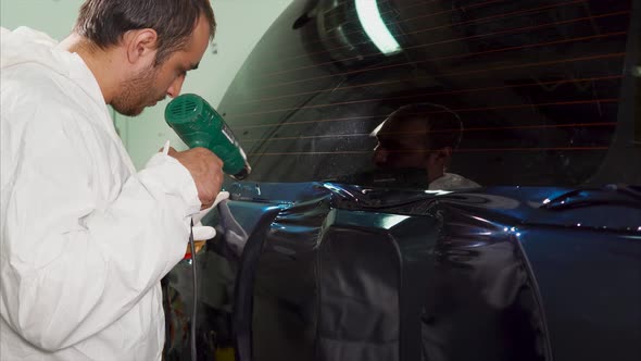 Worker at the Service Station is Further Processed Edge Vinyl By Special Dryer alt