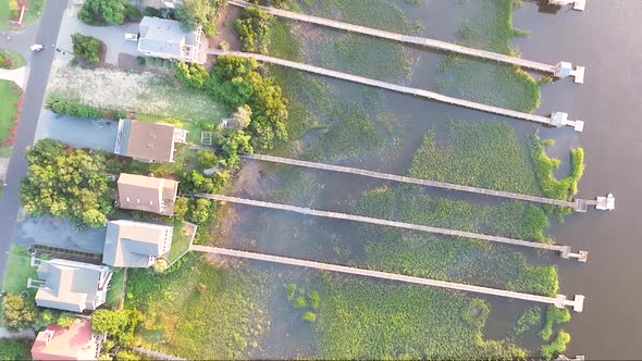 Bird's eye view of houses on the intracoastal waterway in Ocean Isle Beach NC at sunset alt