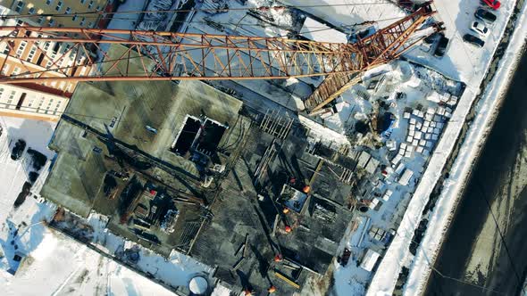 Engineers Work on a Building Site with a Crane. alt