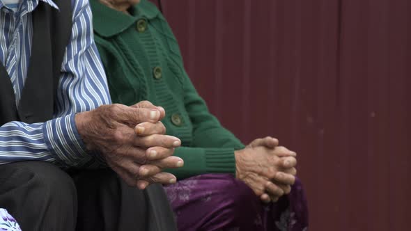 Close Up of Hands of Old Man and Woman alt