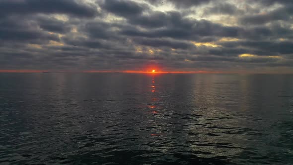 Beautiful sunset aerial shot and ocean with waves