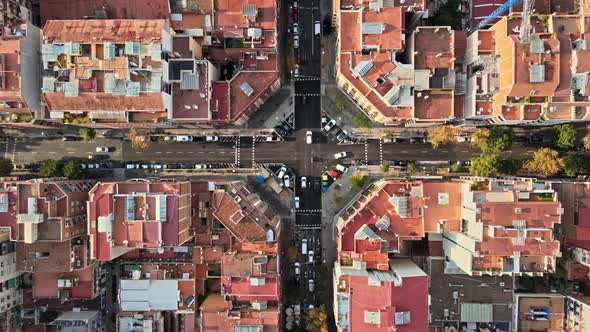 Aerial drone view of Barcelona, Spain. Blocks with multiple residential buildings, roads with cars alt