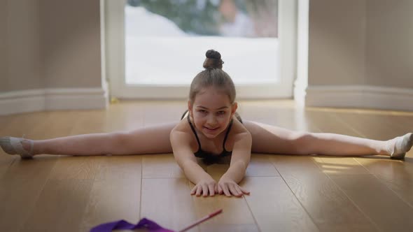 Front View Portrait of Confident Motivated Teenage Gymnast Looking at Camera Bending Forward on alt