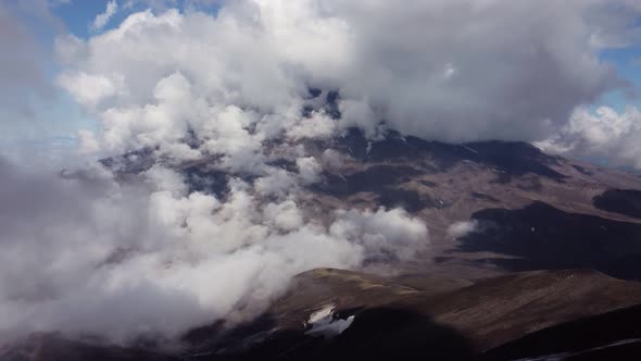 volcano high in white clouds