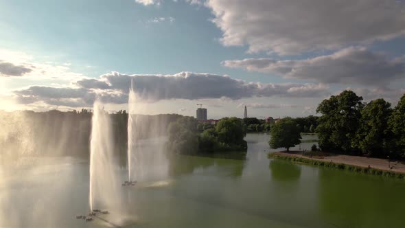 Flying over pond at park in Malmö, Sweden alt