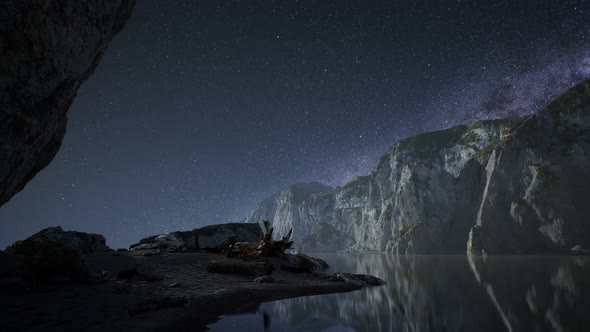 Hyperlapse of Night Starry Sky with Mountain and Ocean Beach in Lofoten Norway alt
