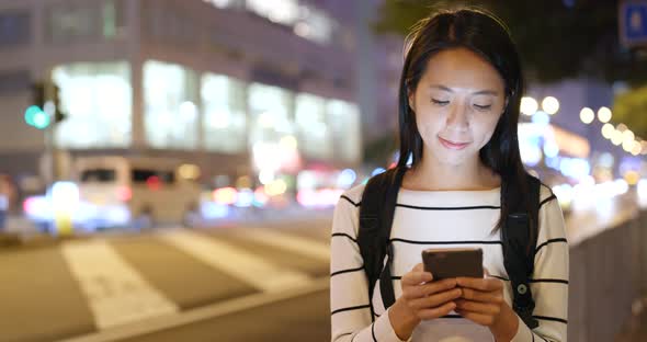 Woman Use of Smart Phone in City at Night 