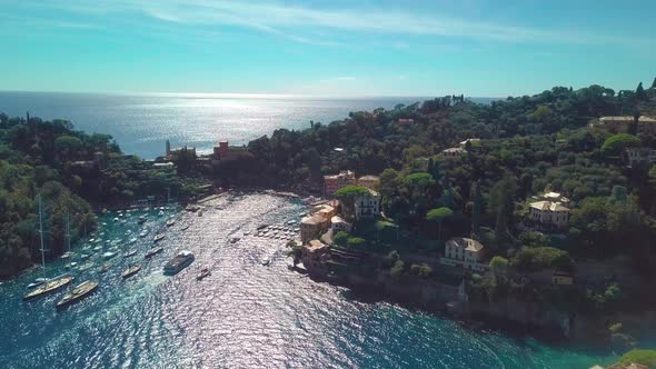 Portofino, Italy, Vessels Move Through Strait Near Coastal Town at Summer Sunny Day. Aerial View alt