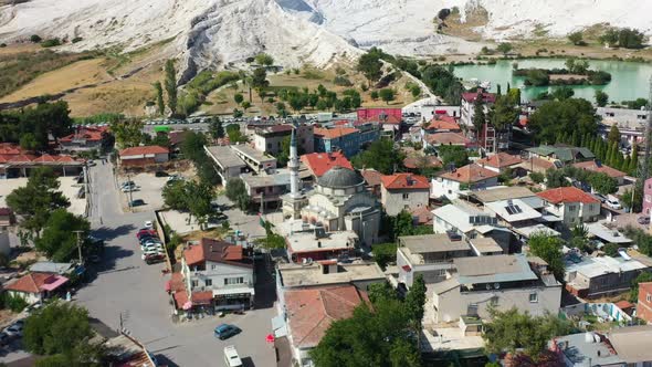 aerial top down view of a small town with residential buildings in Pamukkale Turkey and mineral rich alt
