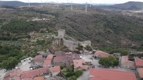 Aerial pullback reveals Castle of Sortelha and its fortifications; Portugal